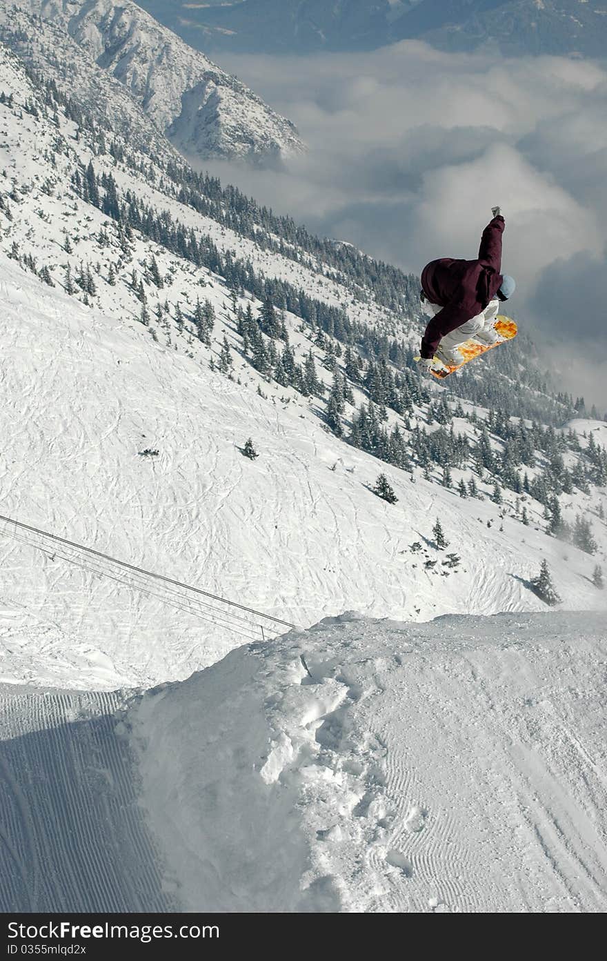 Jumping Freestyle Snowboarder