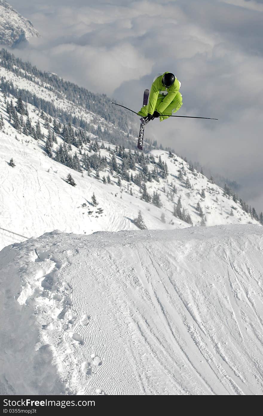 Young freestyle skier jumping high