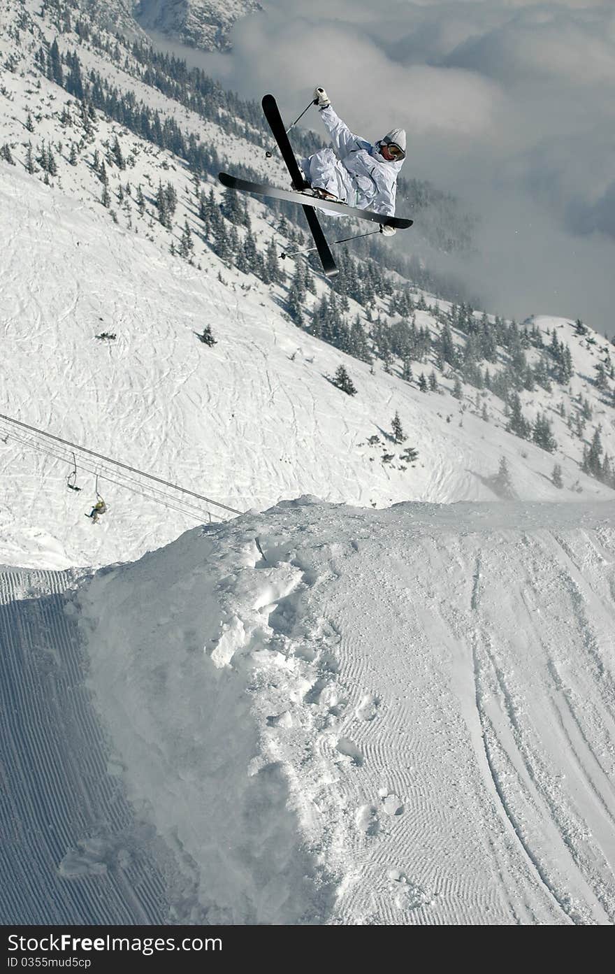 Young freestyle skier jumping high