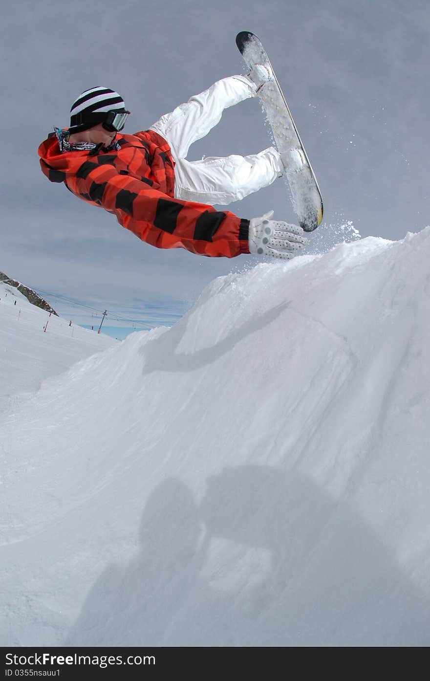 Jumping Freestyle Snowboarder