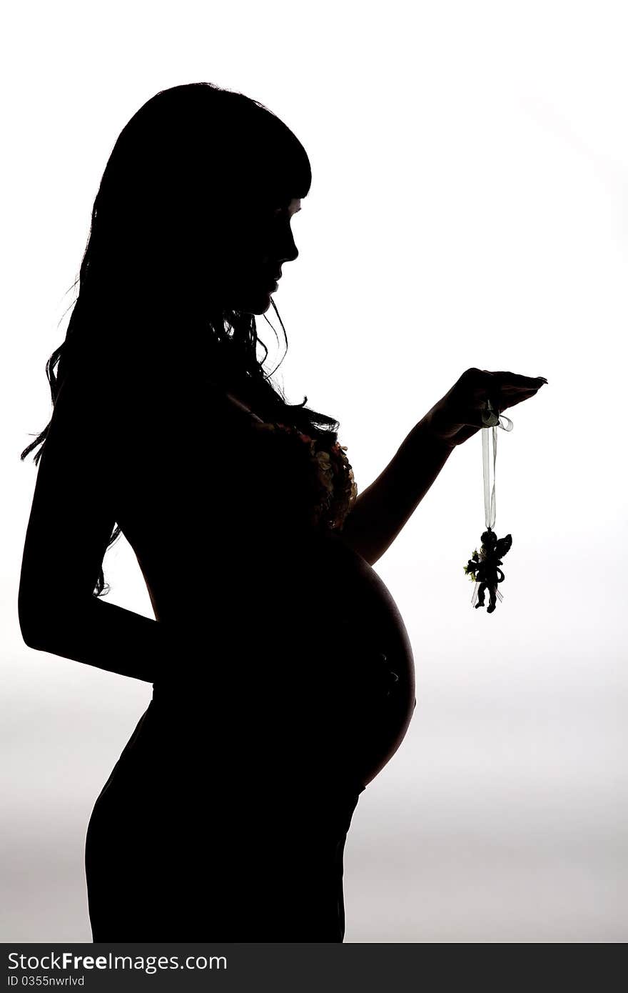 Silhouette a beautiful pregnant woman