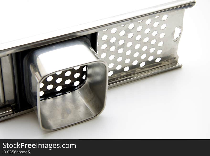 Potato grater of metal with article