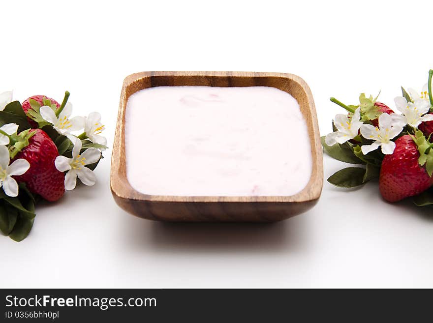 Strawberry yogurt in the wood bowl