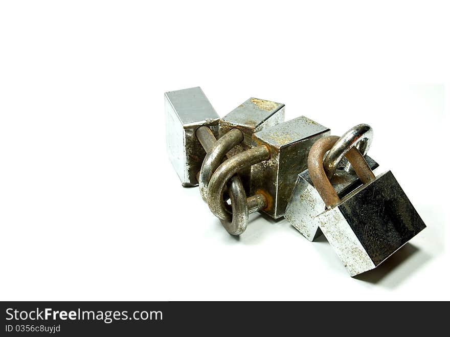 A group of rusted padlocks, isolated white background. Can be use to symbolize security, safety. A group of rusted padlocks, isolated white background. Can be use to symbolize security, safety.