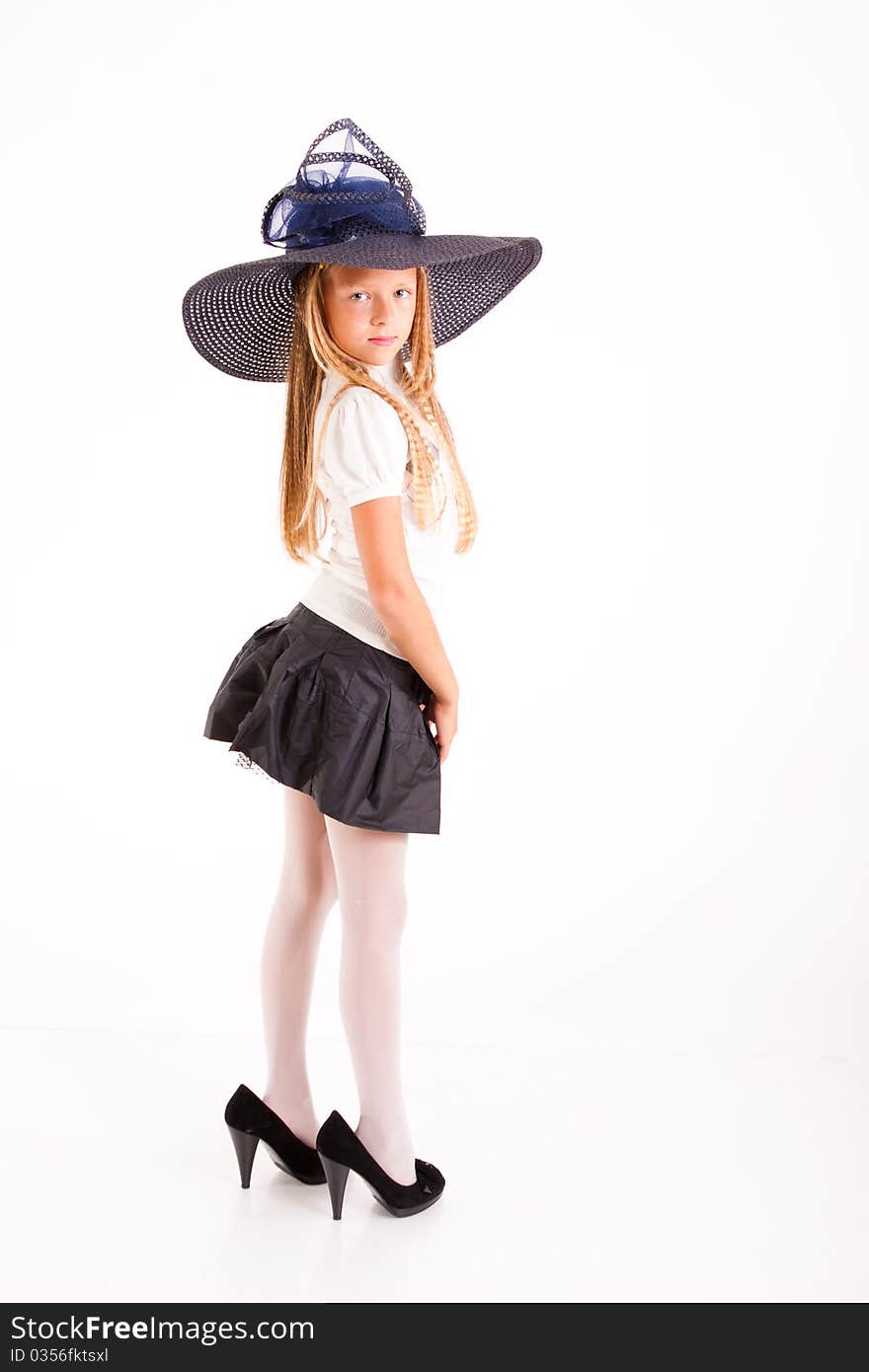 Funny girl in big hat  and mum's shoes, isolated on white. Funny girl in big hat  and mum's shoes, isolated on white