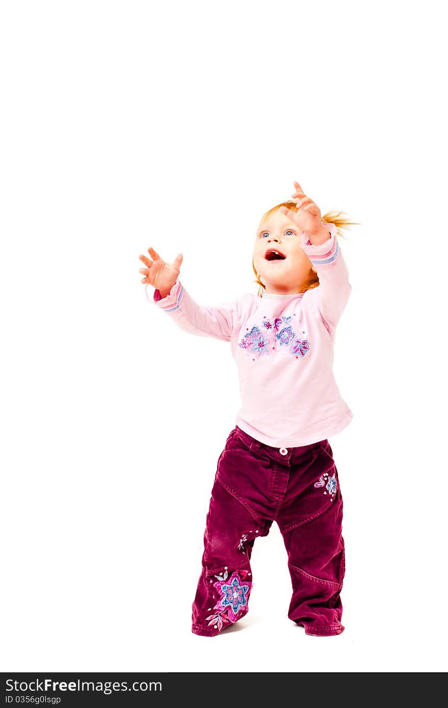 Little girl  with her hands up on a white background