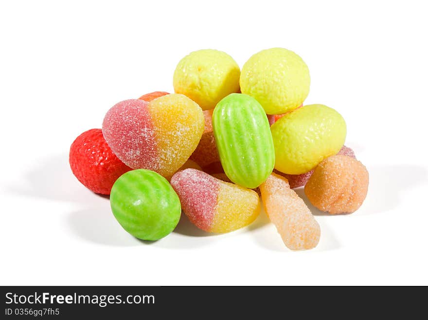 Multi-colored sweets and chewing gums on  white background