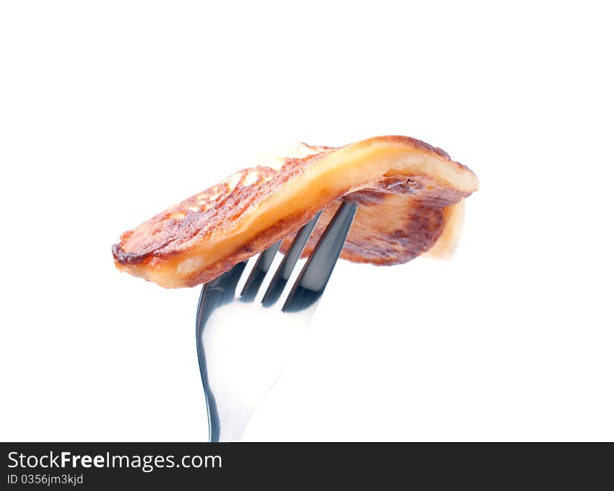 Cooking pancakes on a white background.