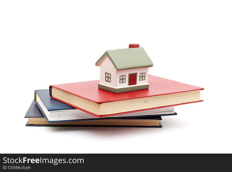 Little house and books isolated on white background