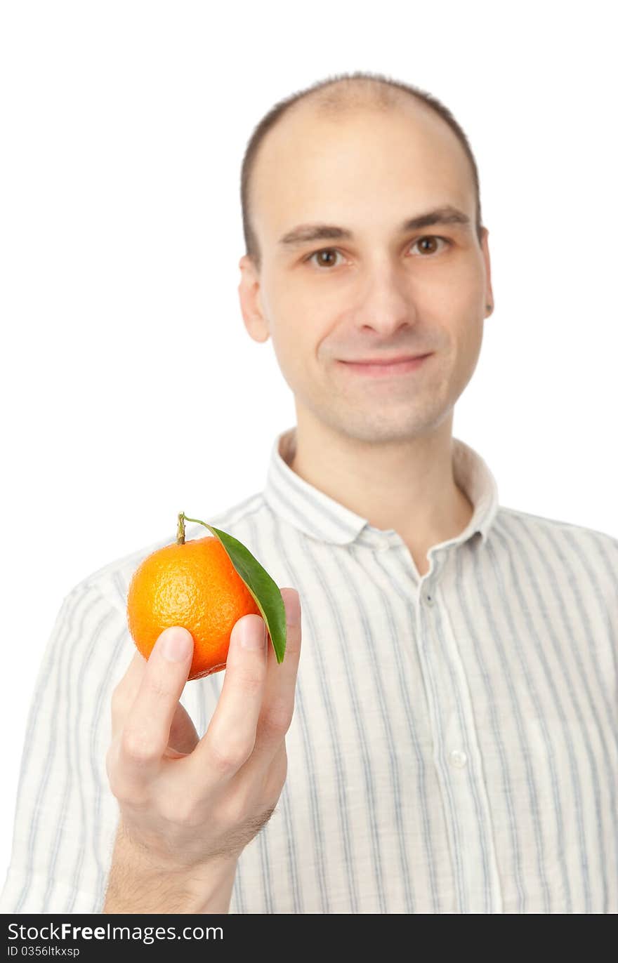 Young man holding tangerine. Isolated on white.