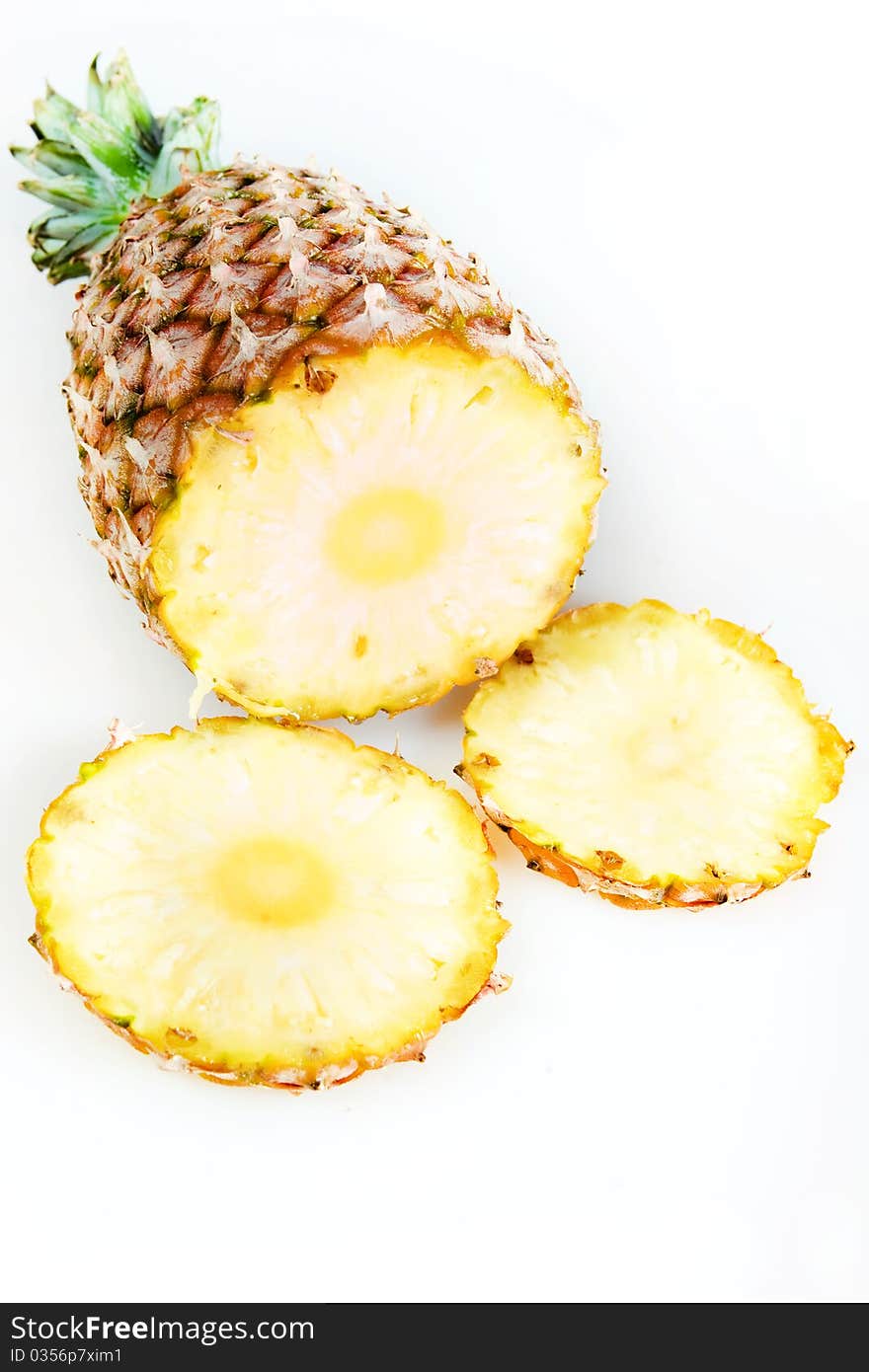 Cut pineapple isolated on white background