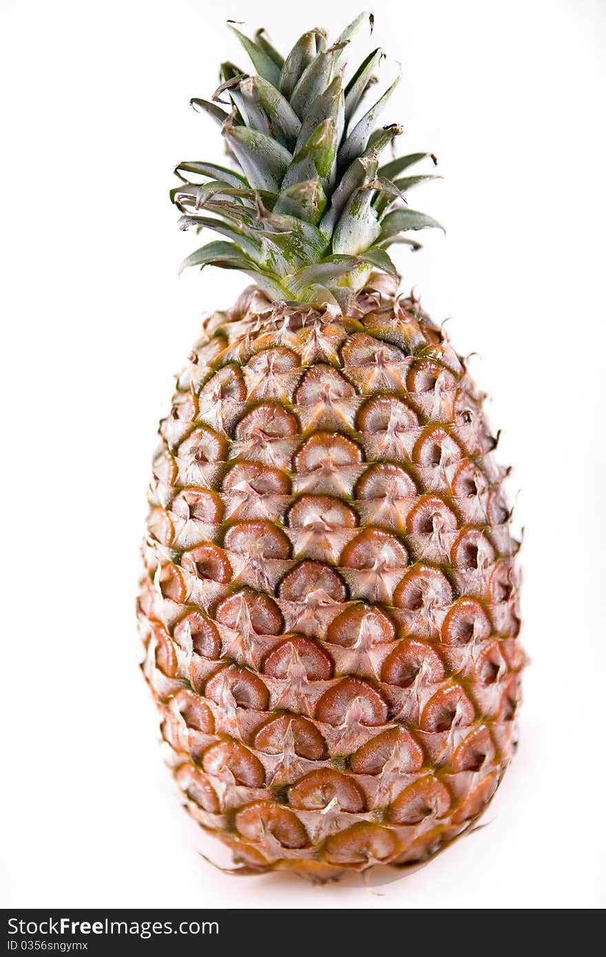 Whole fresh pineapple on white background