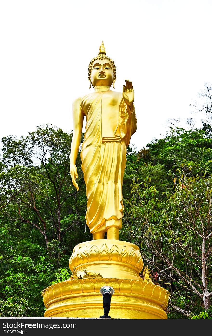 Walking Buddha statue at southern of thailand