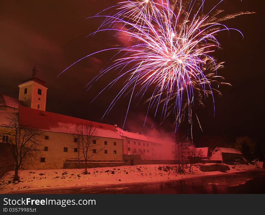 Fireworks near castle, in Strakonice, Czech Republic, New Year celebration