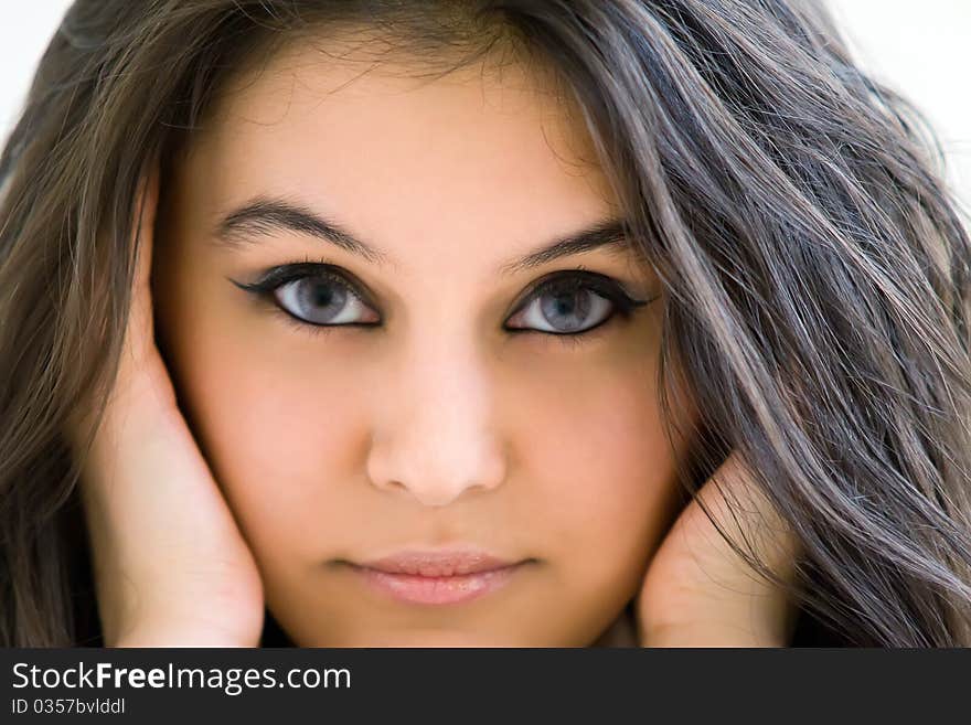 Beautiful Asian girl, photographed in close-up look at the camera. Beautiful look. Hair