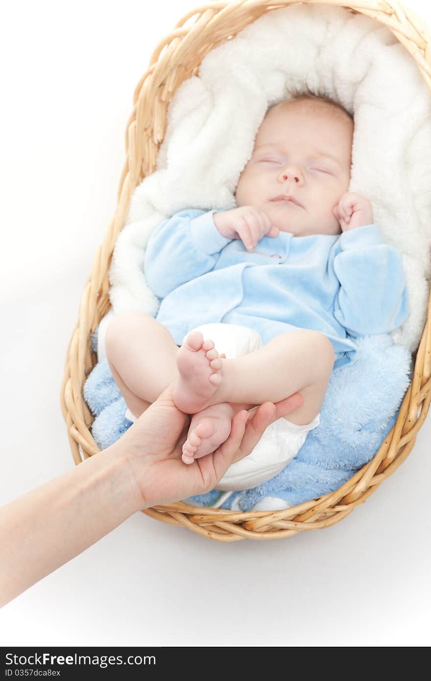 Newborn baby feet in mother hand