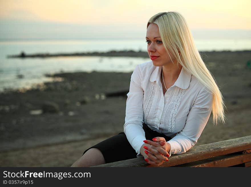 Woman portrait lake on background