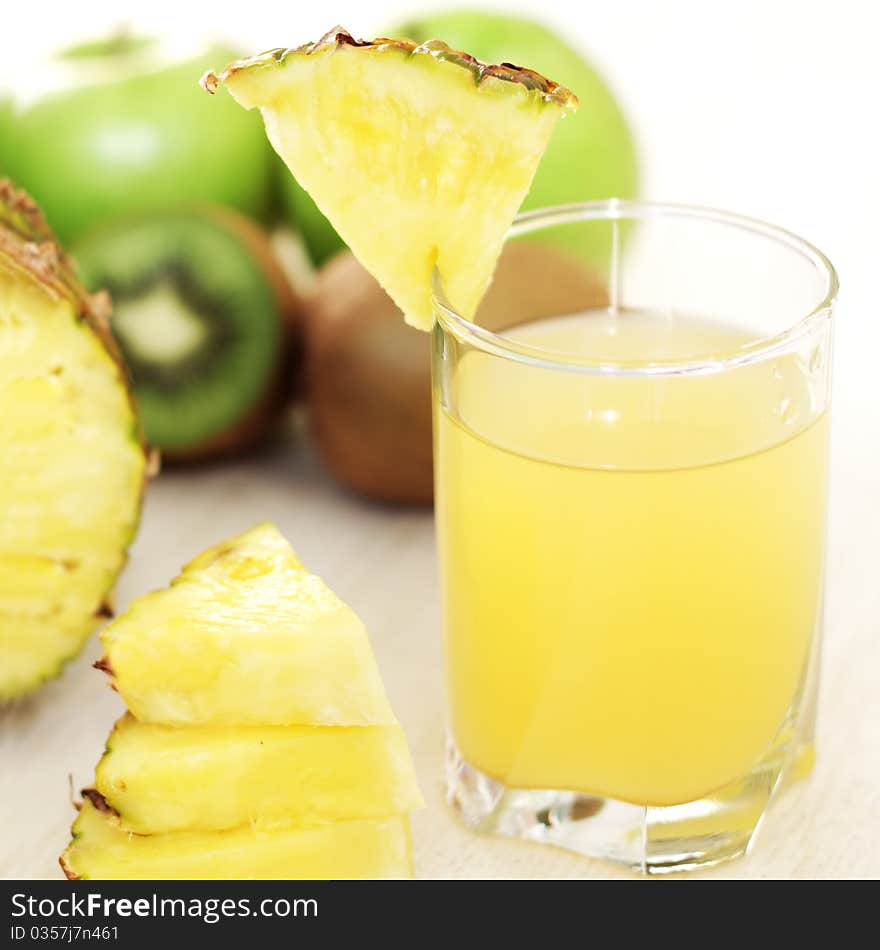 Juice and fruit on light background