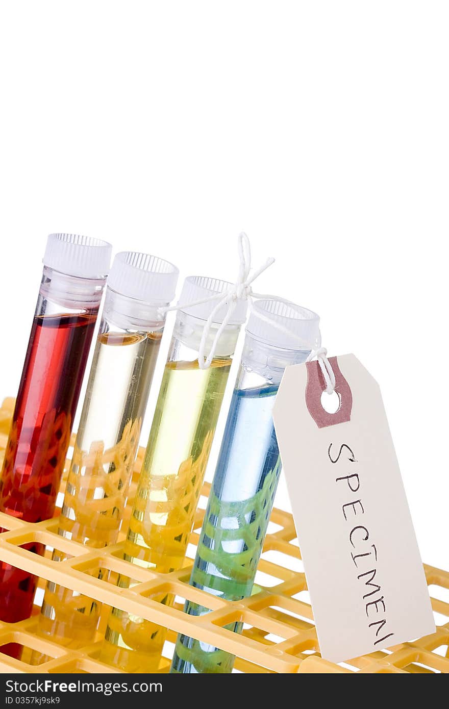 Test tubes in a test tube rack on a white background.