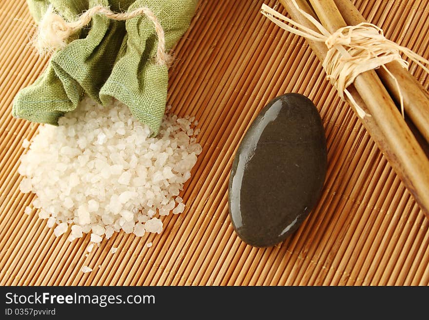 Facilities for body care in a fabric bag of bath salts, related to bamboo sticks and stones. Facilities for body care in a fabric bag of bath salts, related to bamboo sticks and stones