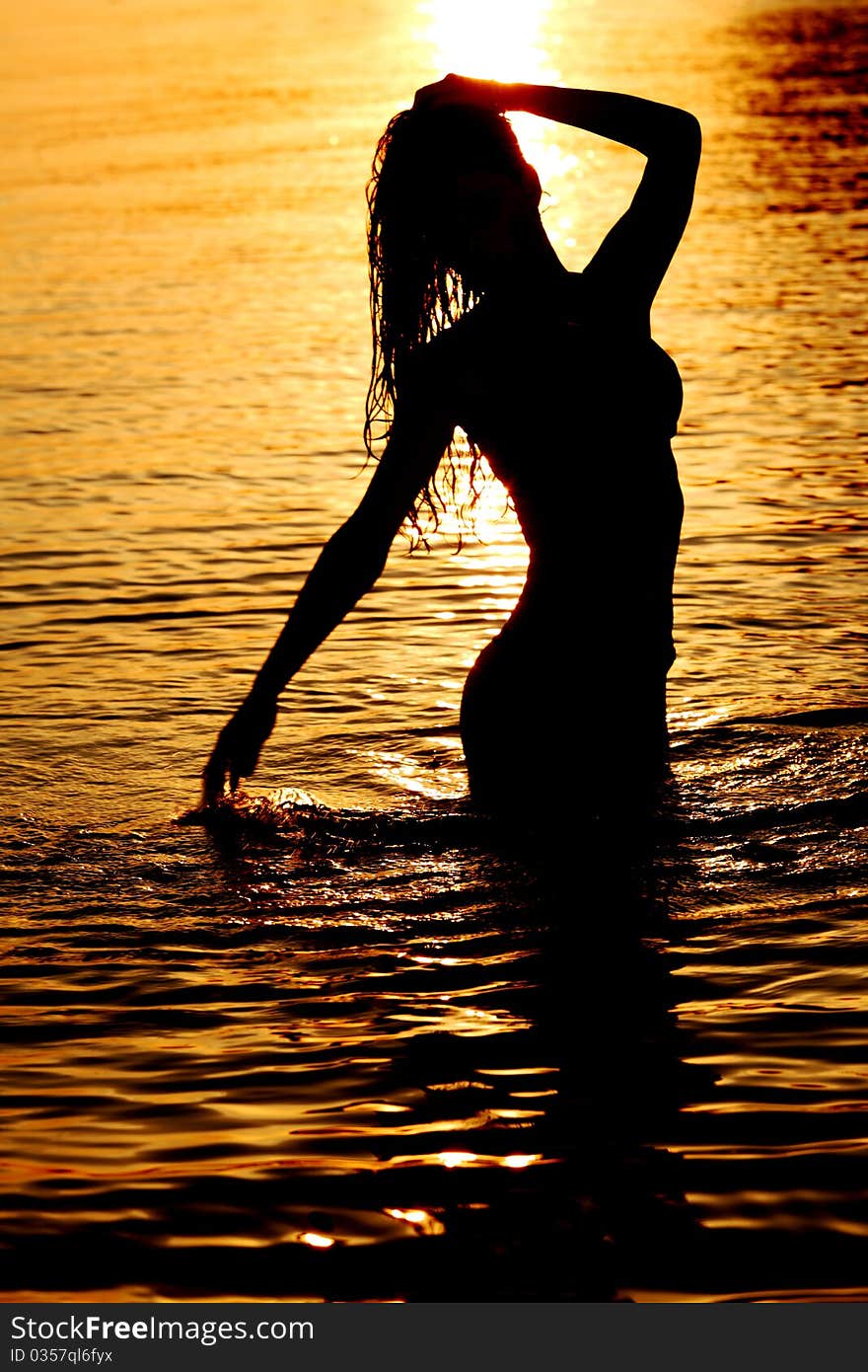 Ocean woman in sunrise light. Ocean woman in sunrise light