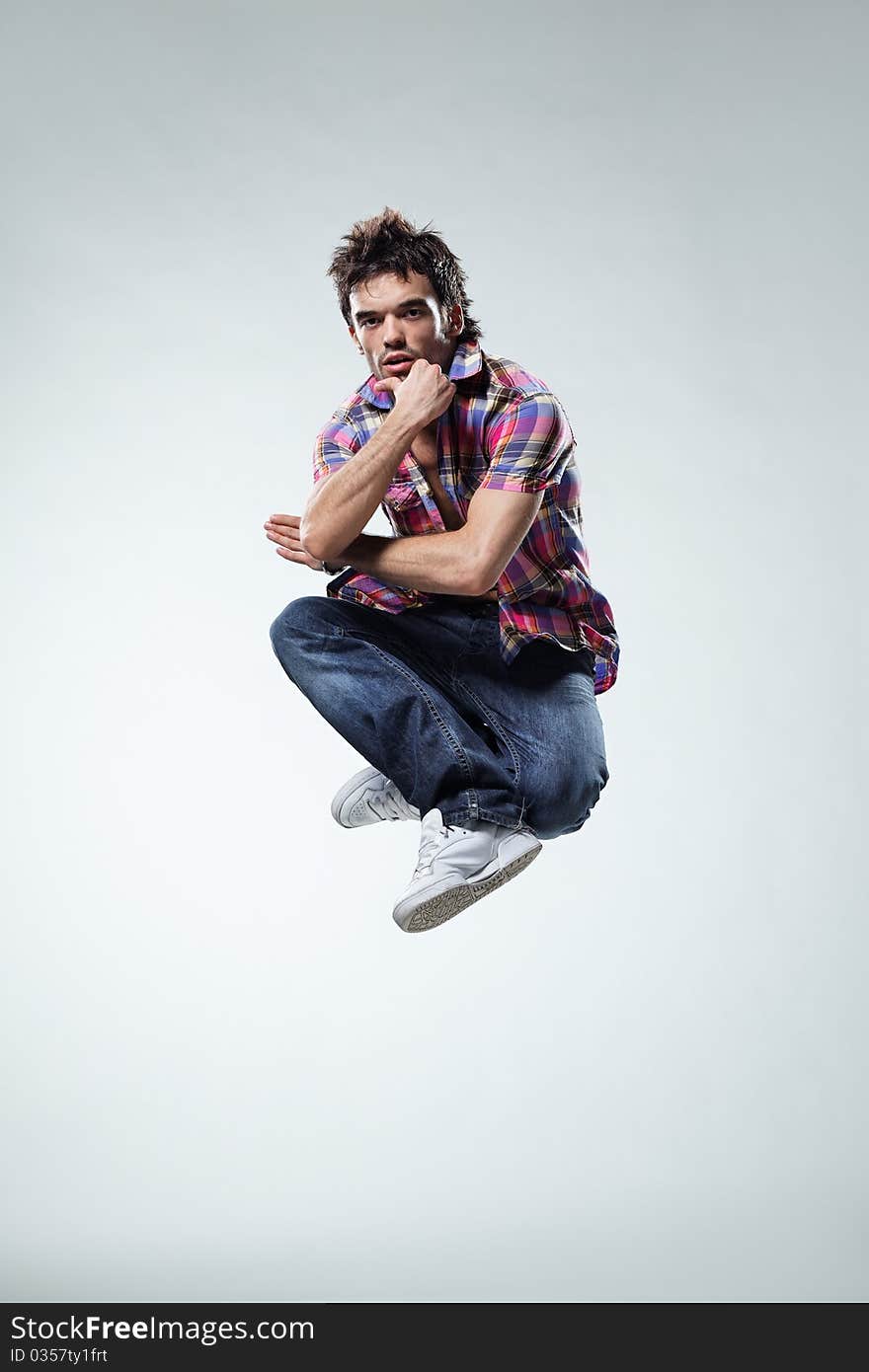 Modern style dancer posing on studio background. Modern style dancer posing on studio background