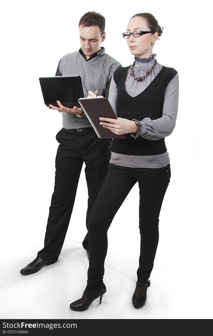 Businessman with the computer and businesswoman at a meeting. Businessman with the computer and businesswoman at a meeting.