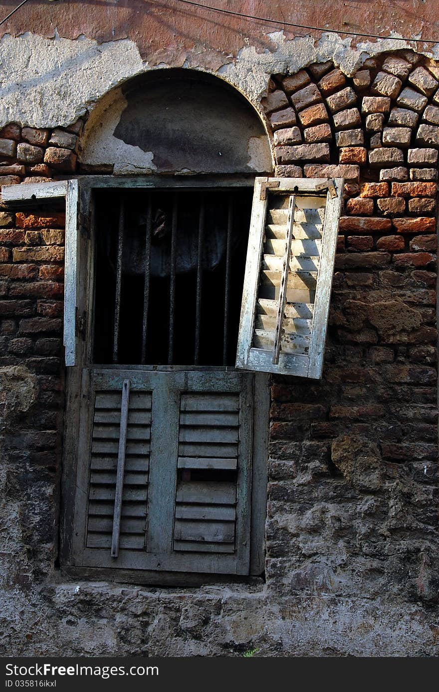 January 08.2011 Kolkata,West Bengal,India,Asia-A traditional broken window of the old kolkata