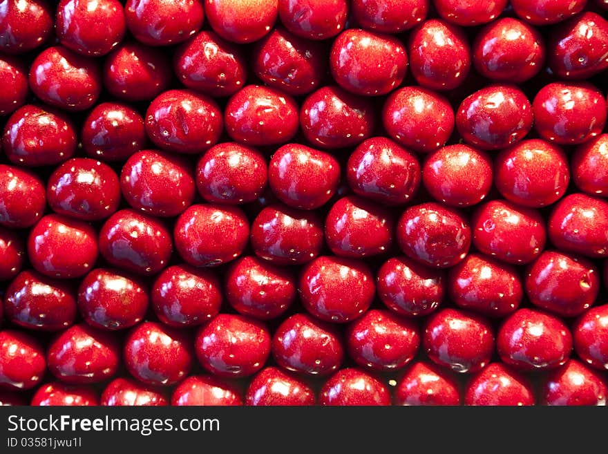 Fresh cherries are stapled in pattern at the market