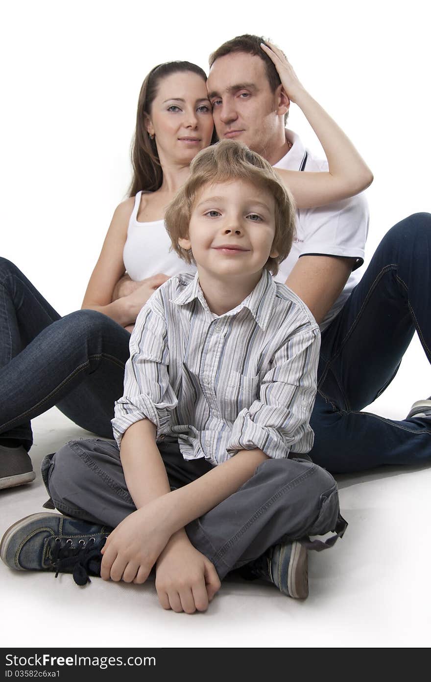 Young European family from three persons - mother, father and son. Young European family from three persons - mother, father and son.