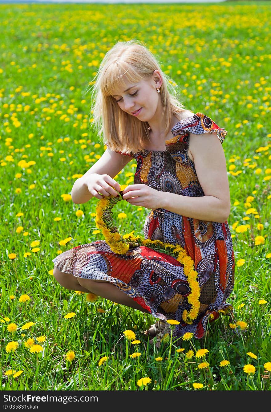 A Woman Is Sitting On A Field