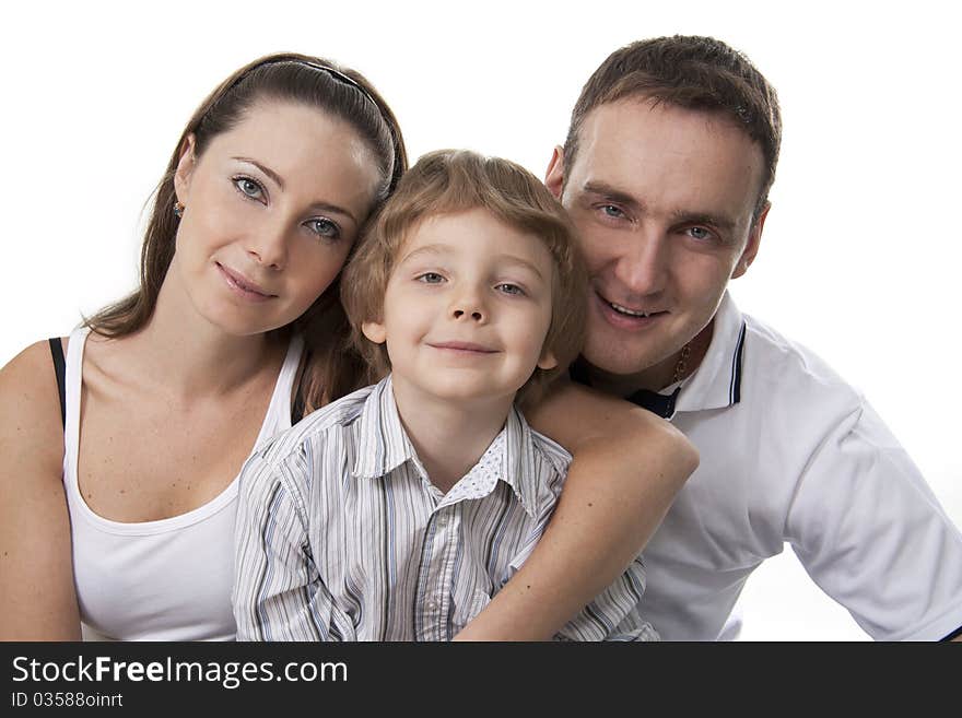 Young European family from three persons - mother, father and son. Young European family from three persons - mother, father and son.