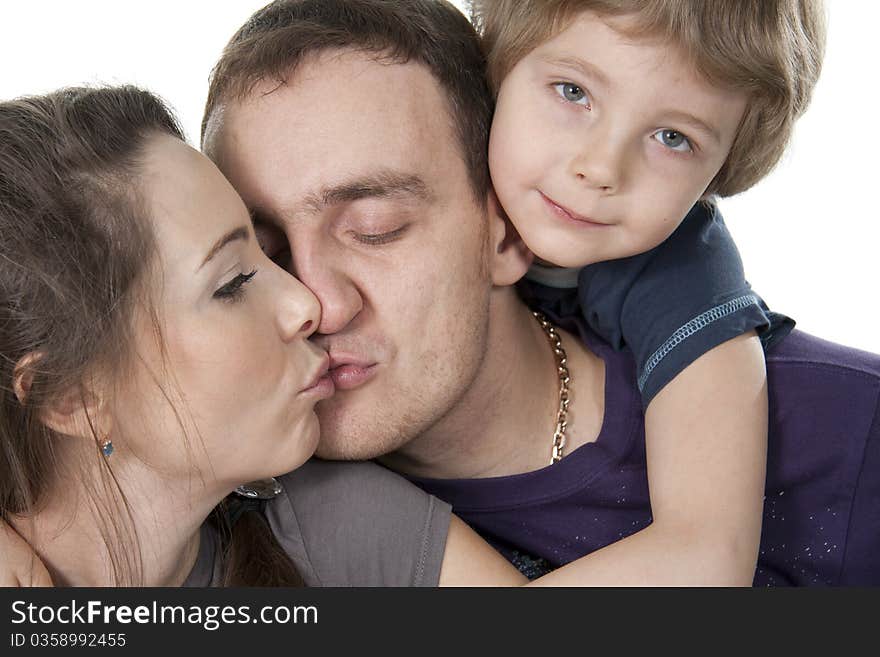 Young European family from three persons - mother, father and son. Young European family from three persons - mother, father and son.