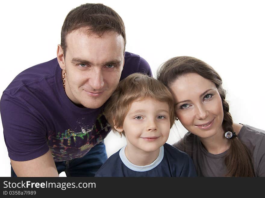 Young European family from three persons - mother, father and son. Young European family from three persons - mother, father and son.