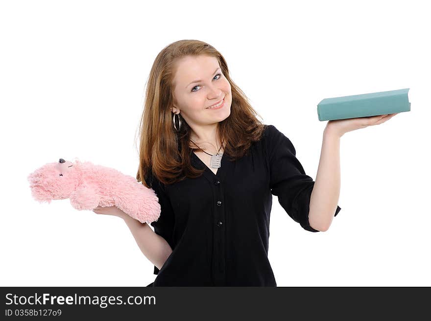 Girl with book and teddy bear , reflects,on a white background