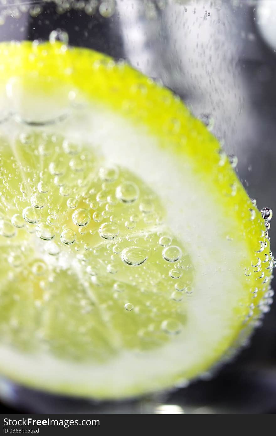 Lemon and drops of carbonated water