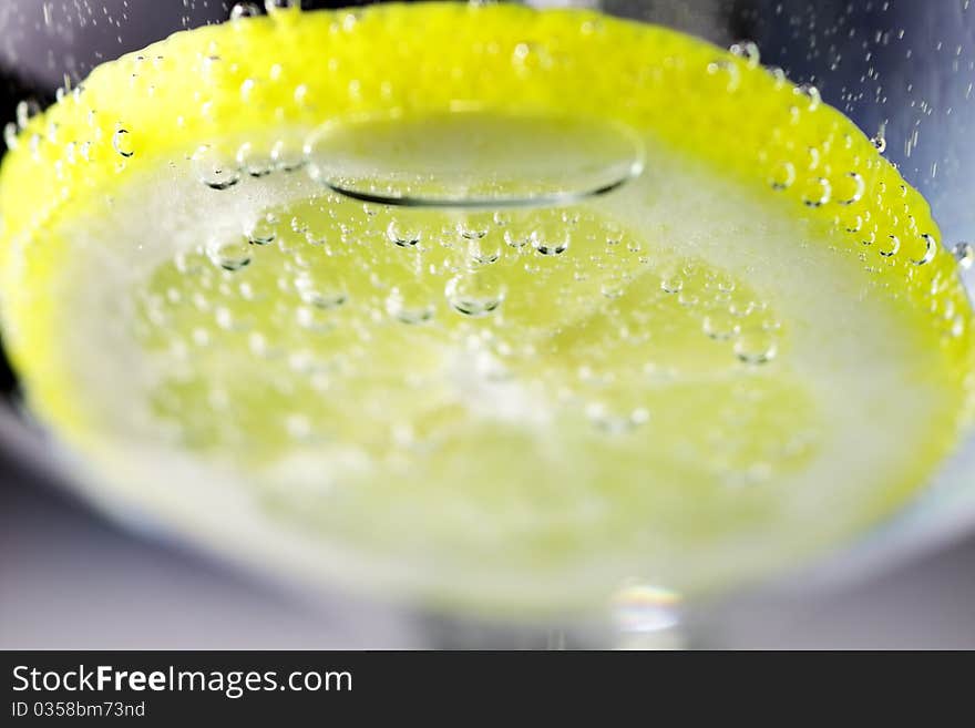 Lemon and drops of carbonated water