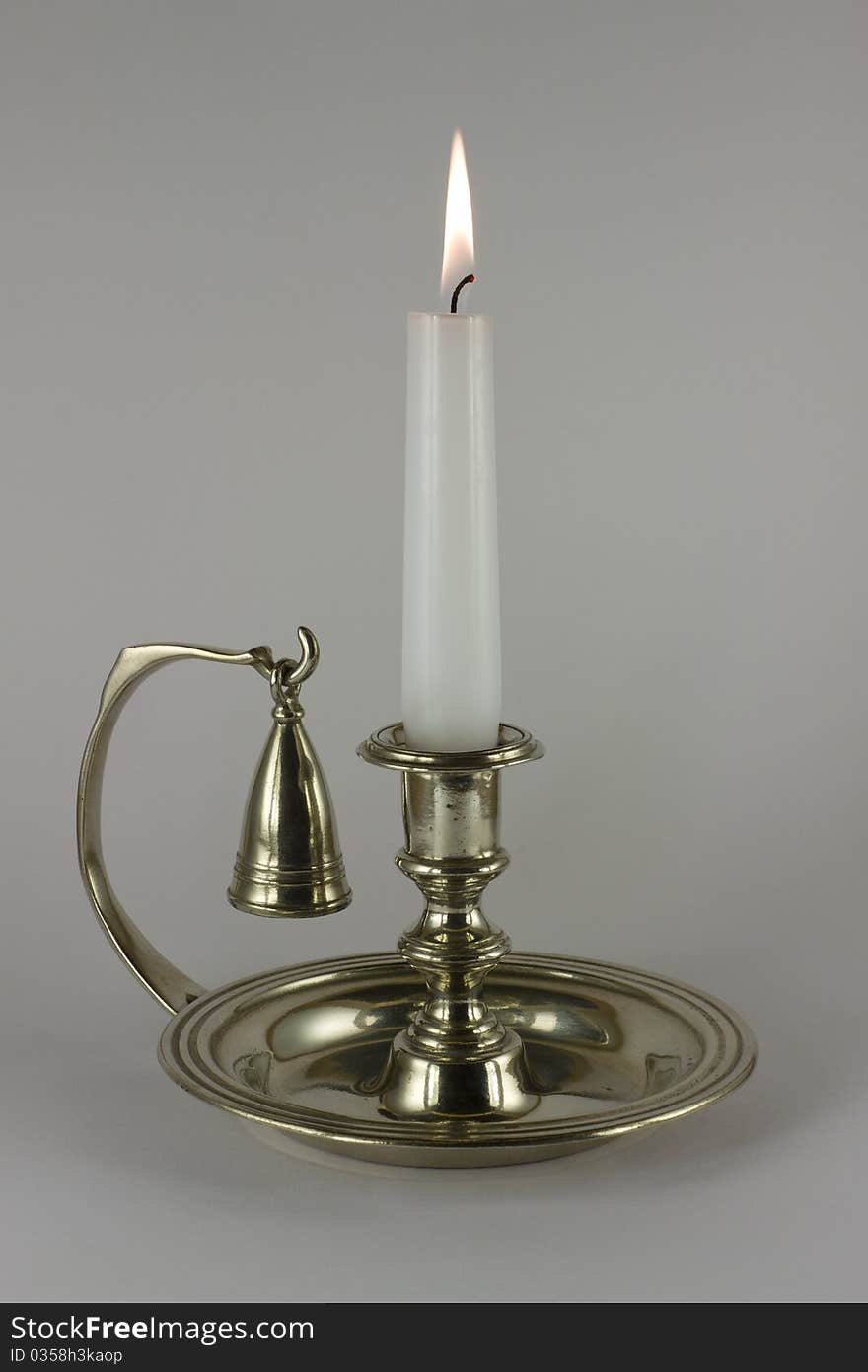 Candlestick with burning candle