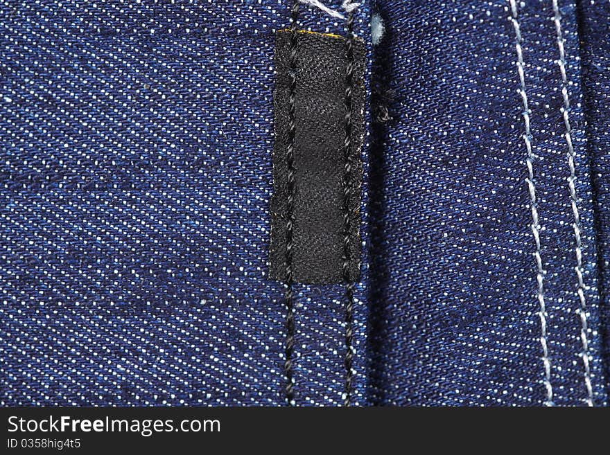 Blue jeans close-up texture of label