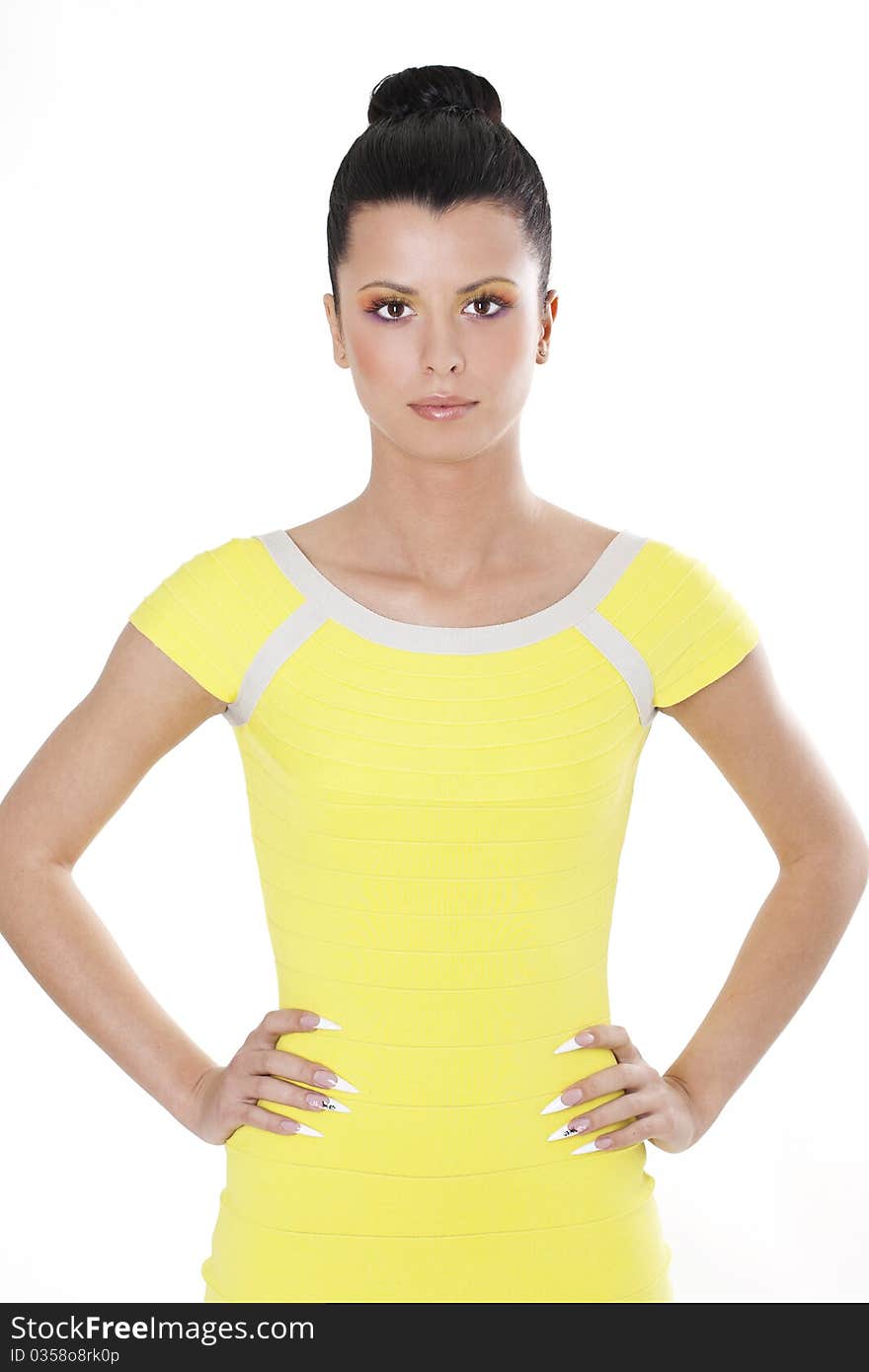 Fashion brunette woman in yellow dress