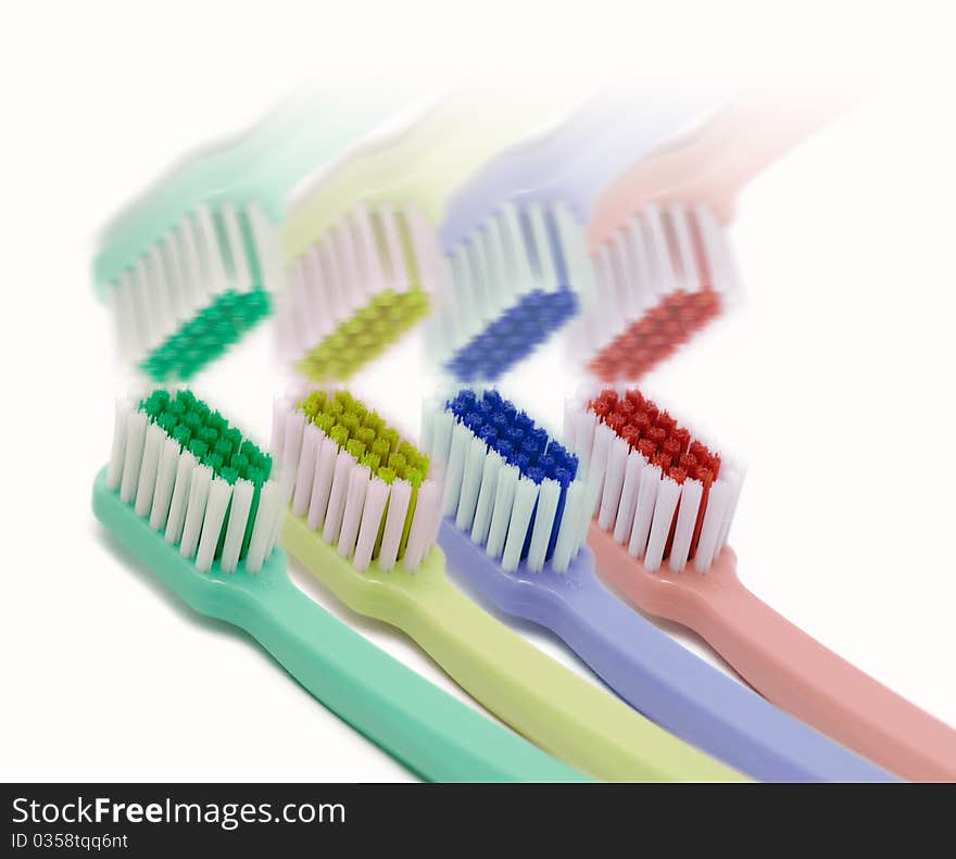 Four Colored Toothbrushes