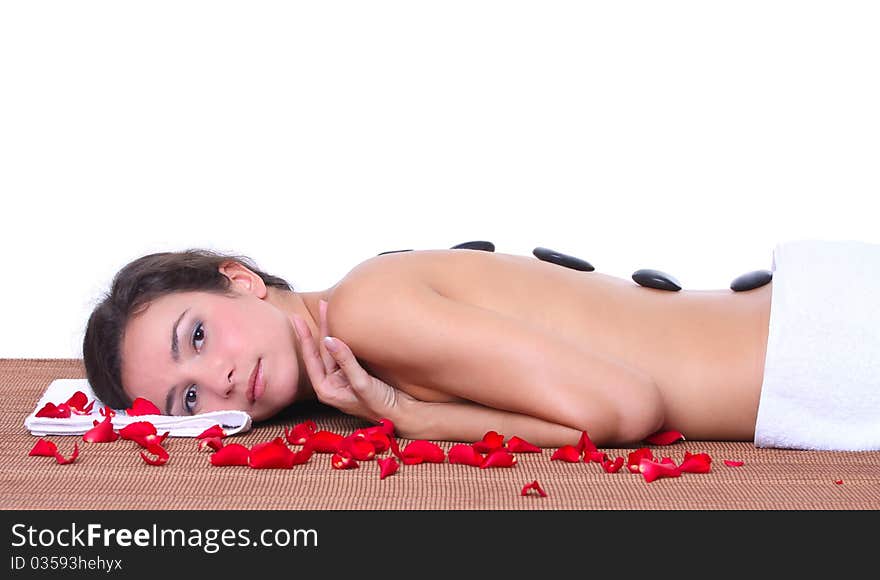 Beautiful woman lying on a brown mat