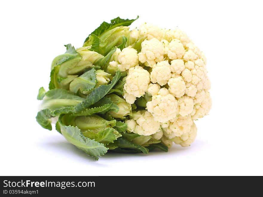 Cauliflower with green leaves isolated on white background