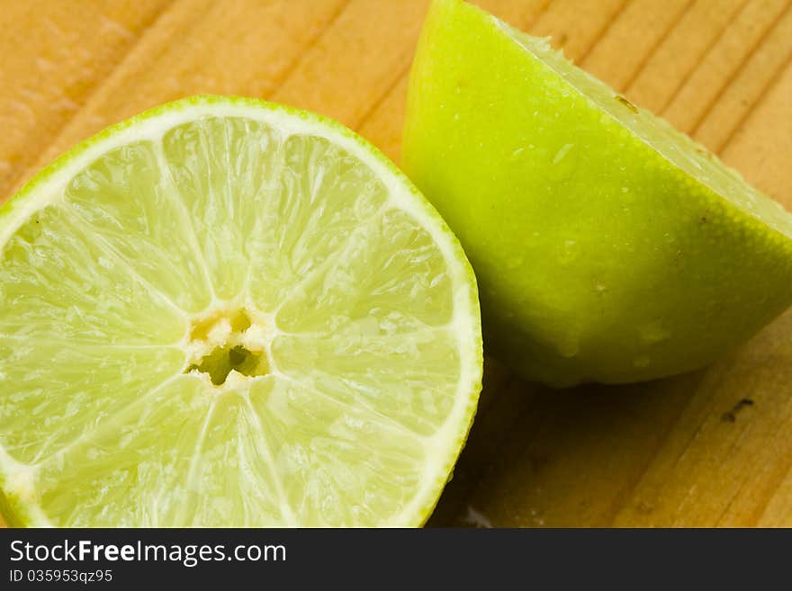 Green organic sweet lime fruit cut in two halves