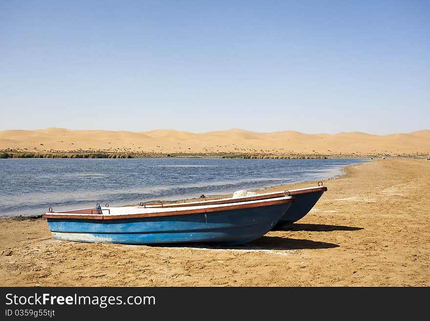 Boat and beach in the oasis. Boat and beach in the oasis