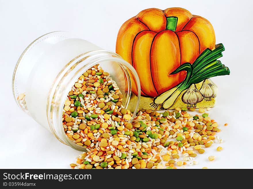 A pot with grain on white background