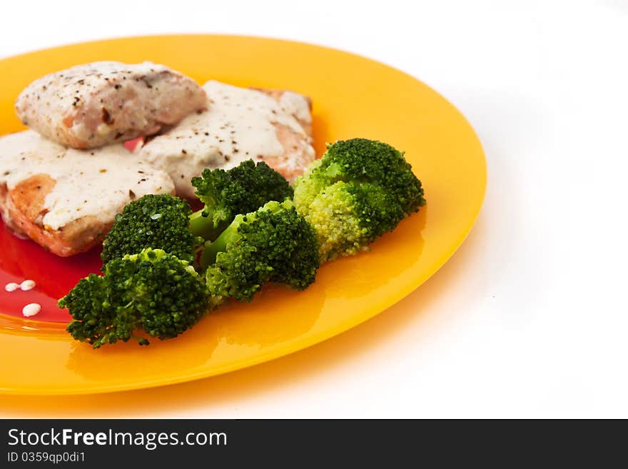 Salmon with broccoli isolated in white