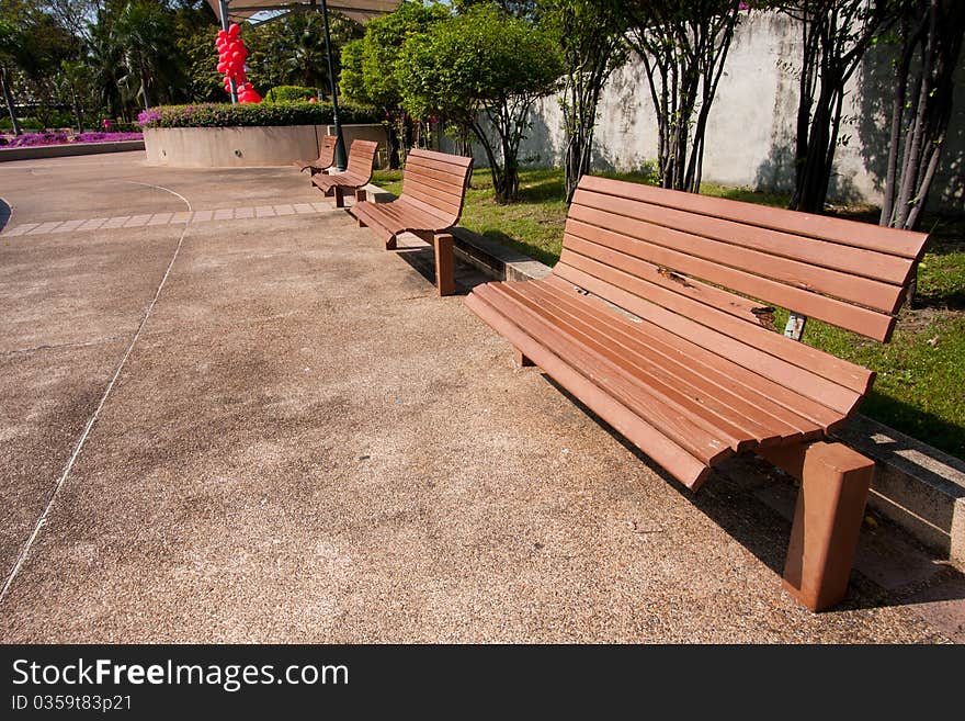 Wooden bench in the park on your holiday tree shade. Wooden bench in the park on your holiday tree shade.