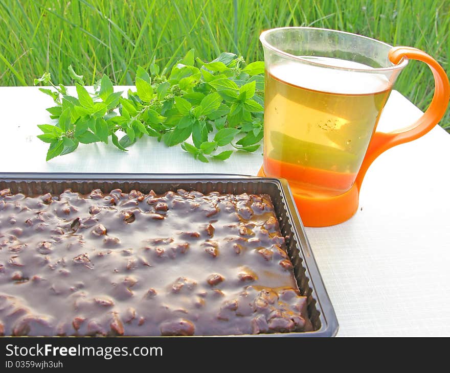 Herbal tea and chocolate cake tea-drinking outdoors