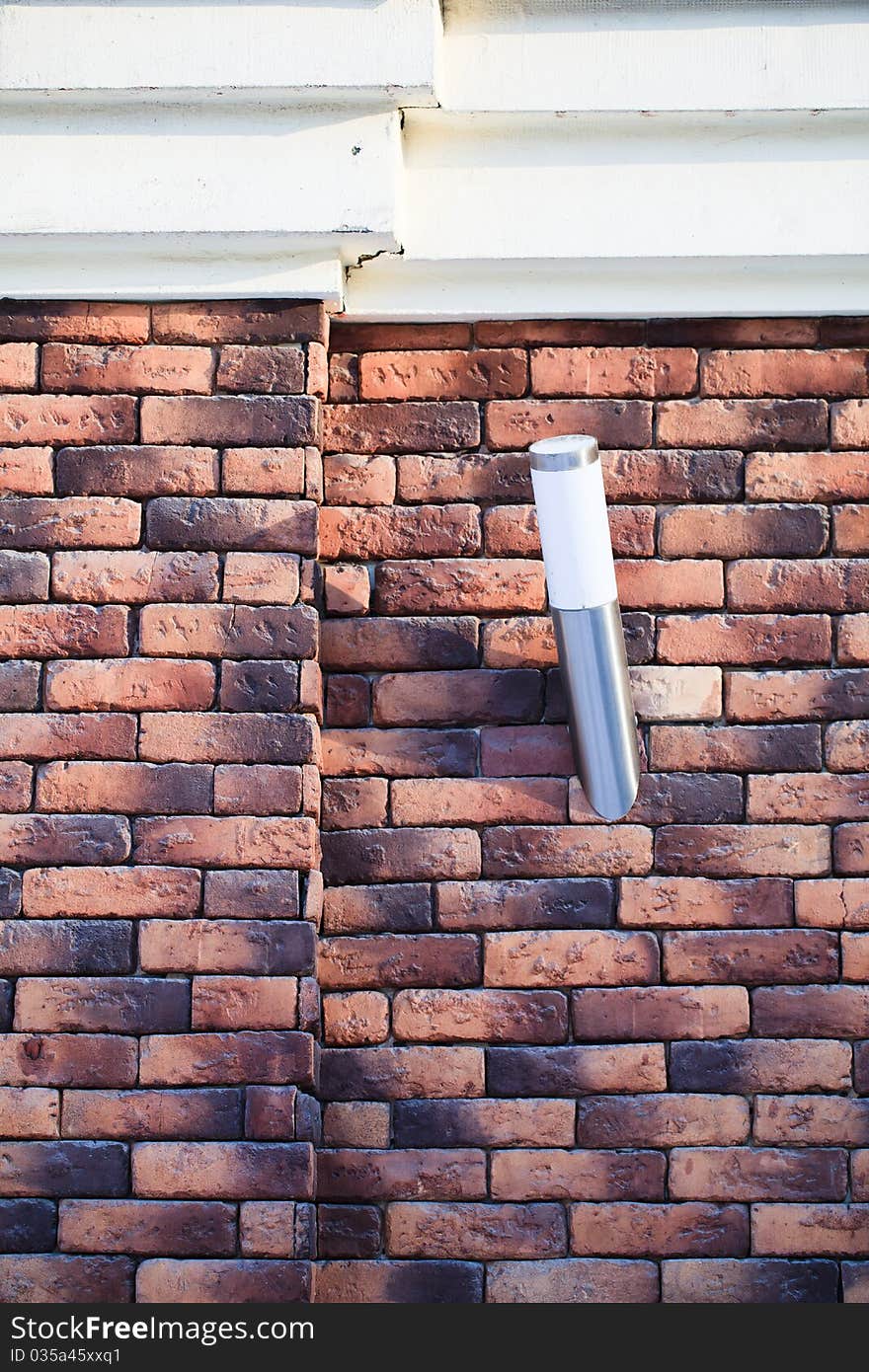 Architectural details: the fixture on a brick wall